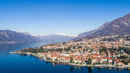 Fototapeta na wymiar City of Mandello del Lario, Lake of Como in Italy. Panoramic view from a drone