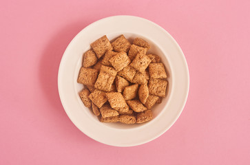 Cereals on pink background