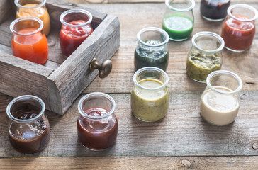 Assortment of sauces in the glass jars