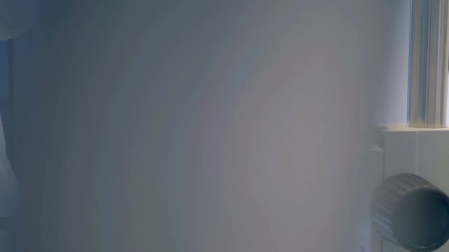 A female scientist is working with sperm sample perfoming IVF, eco, extracorporal fertilization.