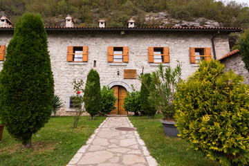 Fototapeta na wymiar Buildings around Moraca Monastery which is a Serbian Orthodox monastery located in the valley of the Moraca River in Kolasin, central Montenegro.