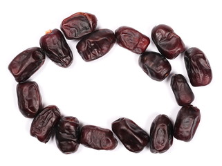 pile dry dates isolated on white, sweet fruit, top view