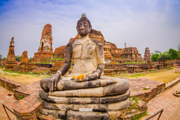 Outdoor view of the ancient budha at Ayutthaya Historical Park in the ruins of the old city