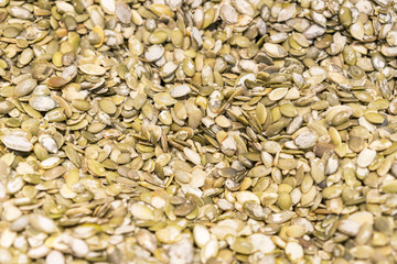 Vegan food. Raw pumpkin seeds for roasting closeup