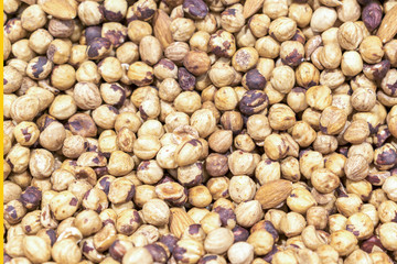 peeled hazelnuts close up, vegetarian food background