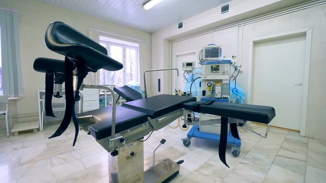 Empty examination chair in a gynecological hospital room