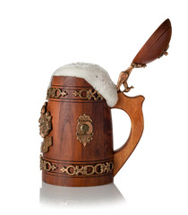 wooden mug with foam beer