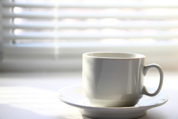 Coffee cup near window