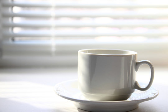 Coffee cup near window