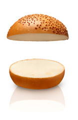 Top and bottom of bun with sesame seeds on white