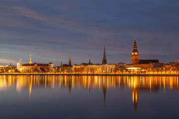 Fototapeta premium Skyline of old town of Riga seen across the river Daugava at night.