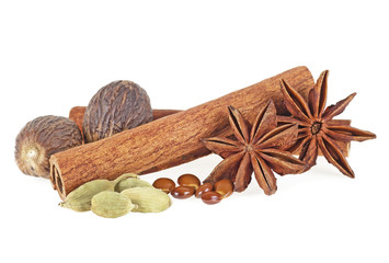 Nutmeg, cinnamon, cardamom and star anise isolated on white background
