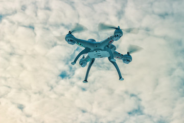 Flight of the drone in the winter forest. The concept of unmanned aerial vehicles. UAV, technology and observations.