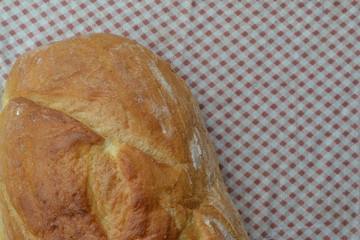 Bread. A loaf of bread. Freshly baked bread. Food. Kitchen. Tablecloth. Delicious. Horizontal photo