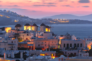Famous view, Traditional windmills on the island Mykonos, The island of the winds, at sunset, Greece