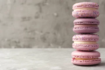 Abwaschbare Fototapete Macarons Pink and violet macarons on light background. Copy space.