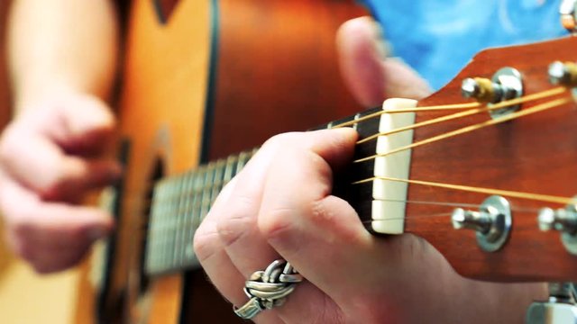 The Guitarist Plays Acoustic Brown Guitar. Fretboard Closeup