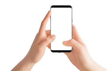 Female hands holding modern black phone in vertical position. Isolated hands and smartphone on white background.