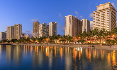 Waikiki Beach at sunset in Honolulu, Oahu, Hawaii - obrazy, fototapety, plakaty