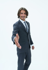 Smiling friendly businessman offers a handshake