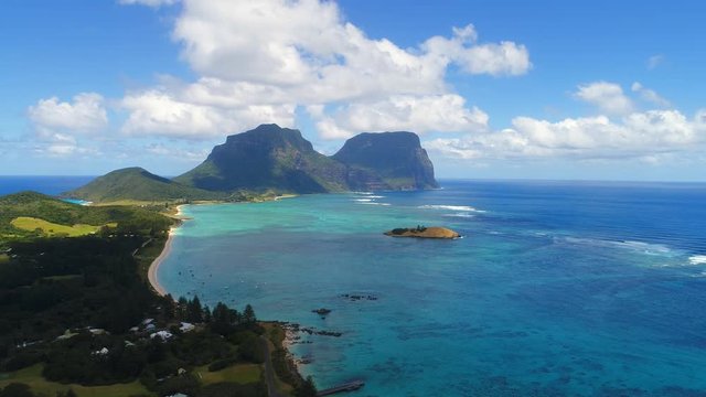 Aerial view of Lord Howe Island (World Heritage-listed paradise), turquoise blue lagoon and Mount Gower on background - New South Wales - Tasman Sea - Australia from above, 4k UHD