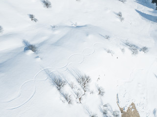 Aerial view of traces of ski in snow covered landscape