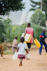 Foto op Plexiglas water cans in Uganda africa © Dennis