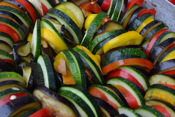 Ratatouille. Vegetable dish. Peasant food. Vegetables, cut into slices. Zucchini, pepper, tomato,...