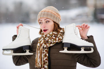 the girl on the figured skates on a opened skating rink