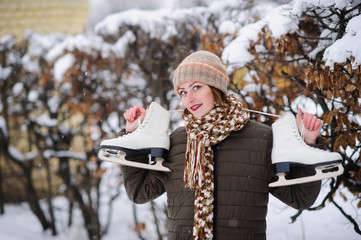 the girl on the figured skates on a opened skating rink