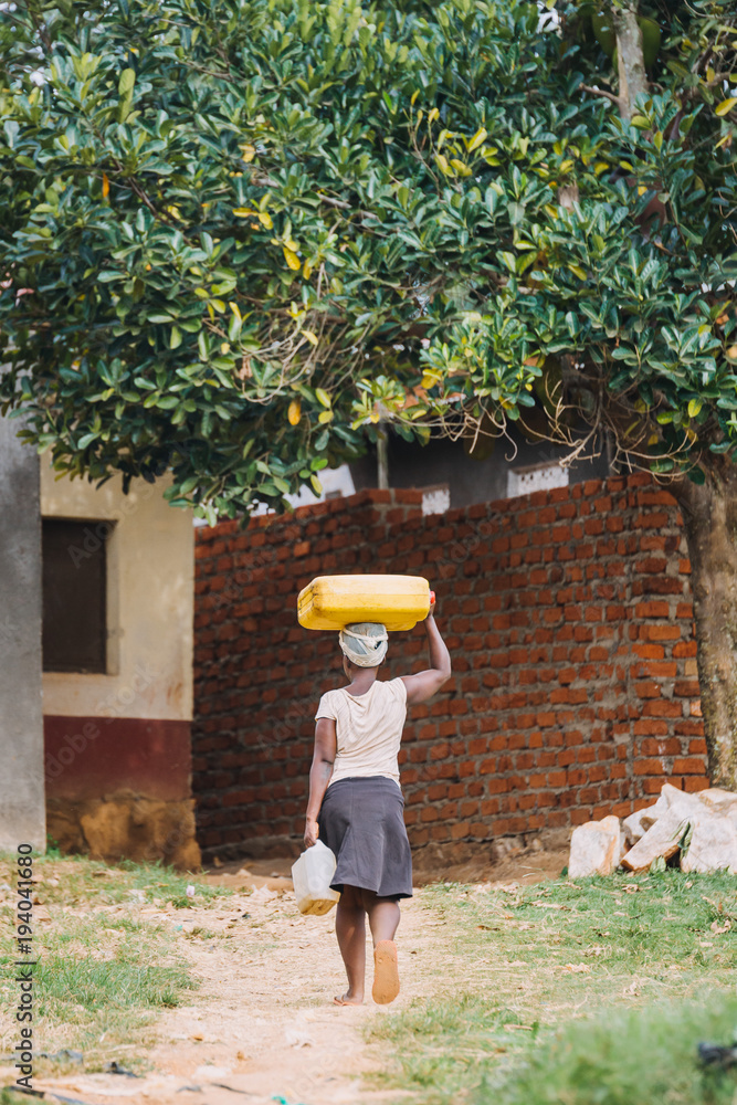 Wall mural water cans in Uganda africa