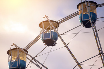 cabs of a Ferris wheel under the sunlight, toned