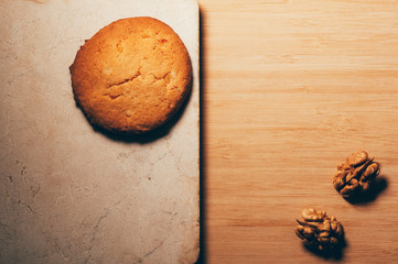 Biscuit on a stone table with walnuts