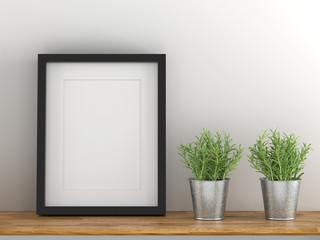 Blank black picture frame template for place image or text inside with a little tree on wood table.