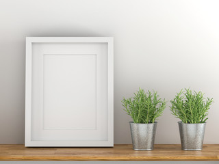 Blank white picture frame template for place image or text inside with a little tree on wood table.