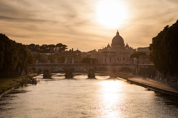 Obraz premium Famous cityscape of Rome with Basilica Di San Pietro in Vatican and Ponte Sant Angelo in foreground, Rome, Italy