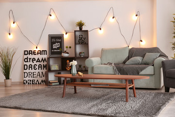 Elegant living room interior with comfortable sofa and table
