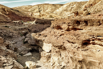 Detail from the Red Canyon tourist and geological attraction in Israel. HDR image with black gold filter