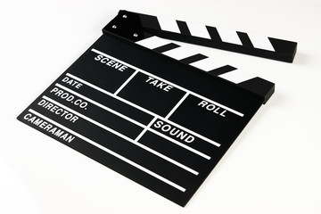 Fototapeta na wymiar Movie production clapper board. Black clapperboard isolated on white background with copy space, close-up. 