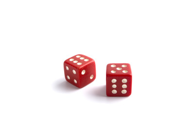 Red Dice in Air Rolling with Shadows Isolated on White Background.