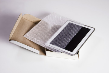 Tablet telephone safety package isolated on white