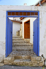 Naklejka premium Blue door and stone steps in the old village of Laneia, Limassol district, Cyprus