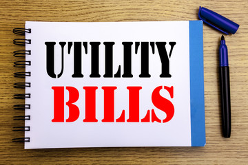 Handwriting Announcement text showing Utility Bills. Business concept for Money Bill Payment Written on notepad note paper background with space office view with pencil marker