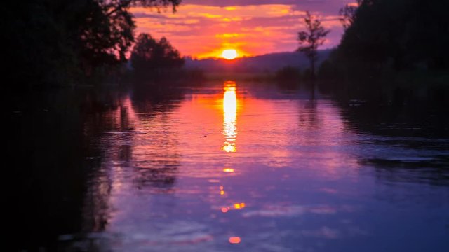 Sunset at calm river, closeup