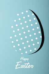 Easter greeting card with pastel cyan paper eggs with dots .Creative greeting concept. Inscription happy easter.Layout Minimalism
