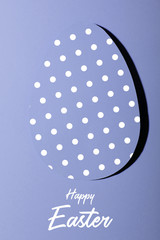 Easter greeting card with pastel violet paper eggs with dots .Creative greeting concept. Inscription happy easter.Layout .minimalism