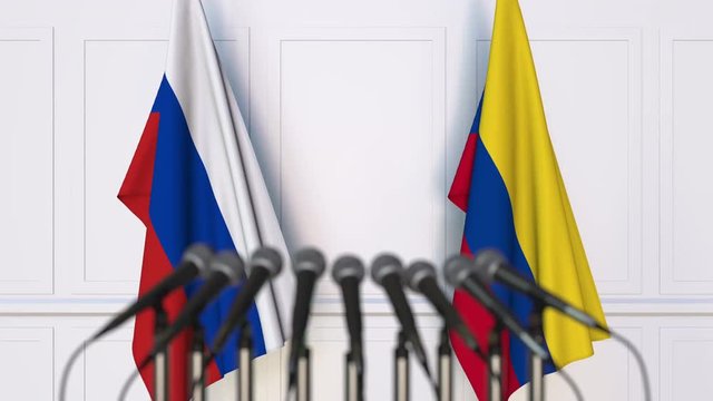 Flags of Russia and Colombia at international meeting or negotiations press conference