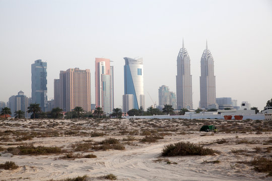 DUBAI, UAE - FEBRUARY 2018: A view of Dubai skyscrapers  from black palace public beach.