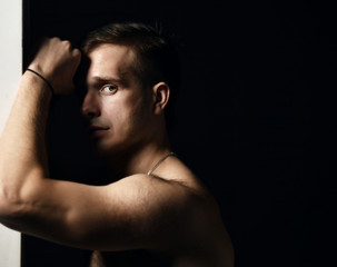 Fototapeta premium Closeup portrait of sexy handsome topless male model 