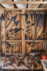 Old traditional carpenter's workshop with its wealth of tools and wood.	